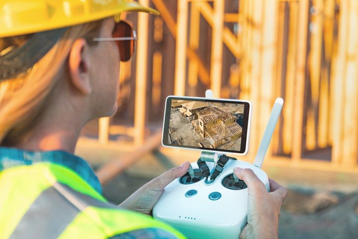 Construction Worker Operating Drone Technology